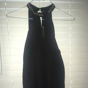 Nice black high neck top with rhinestone neck